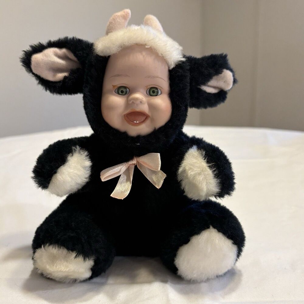 Vintage Rubber Face Baby With Cow Plush Suit